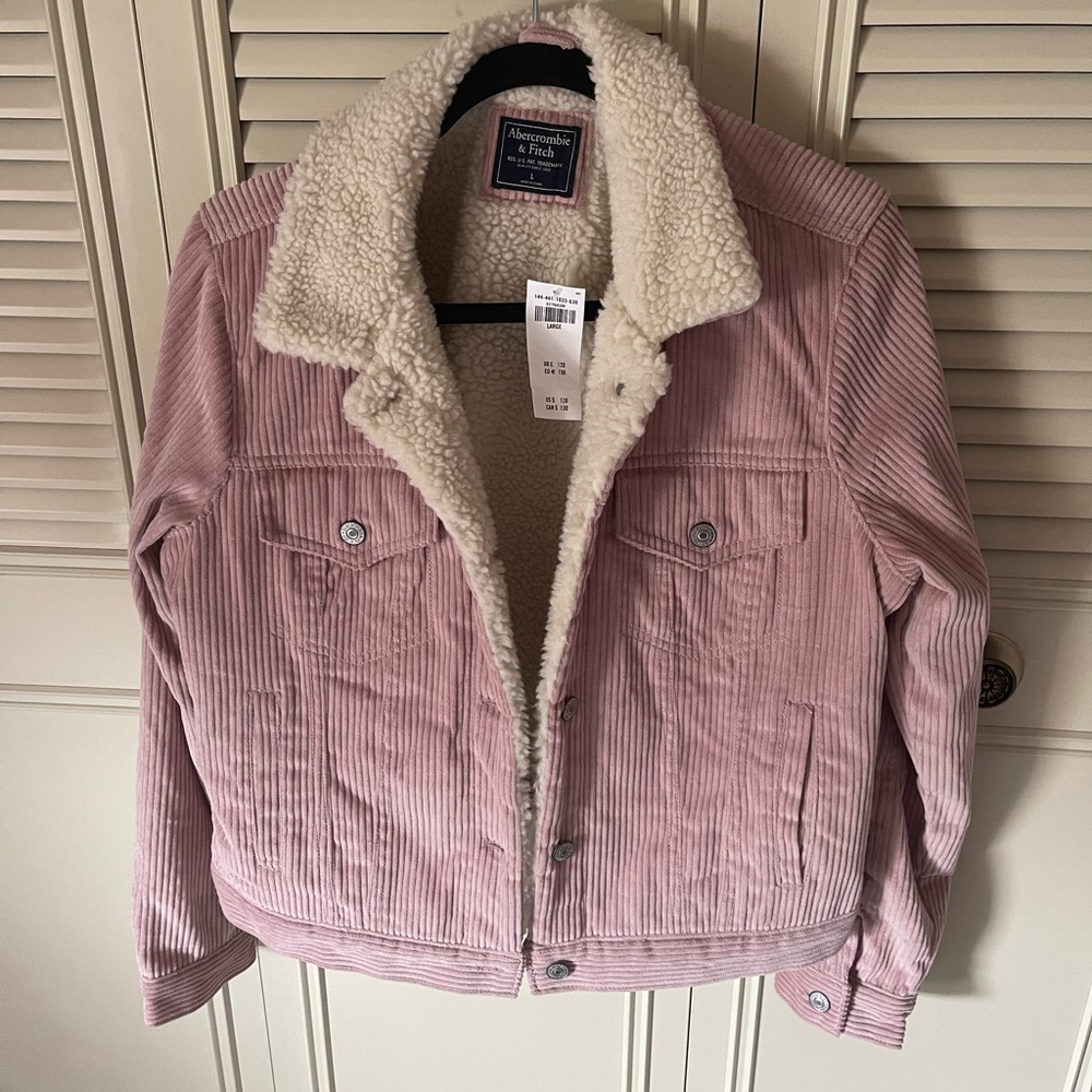 New with tags Abercrombie jacket. Light pink with fur lining.